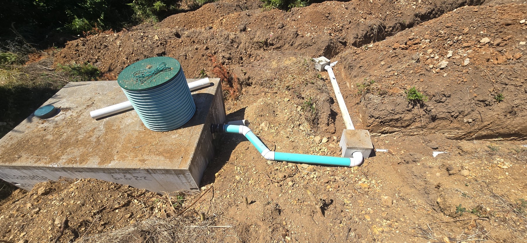 Septic tank, riser and exposed connection in Eli’s July 27 photo record